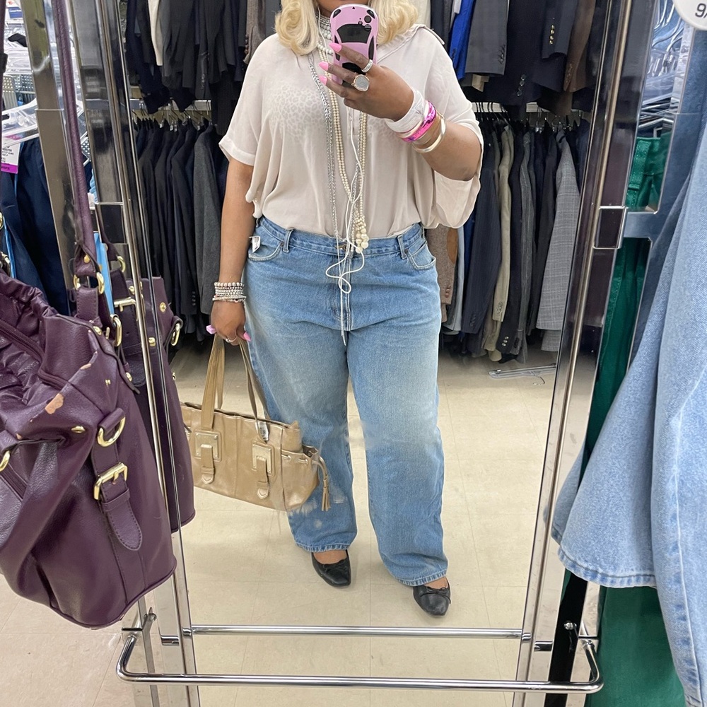 High-waisted blue denim jeans with a relaxed fit #denim #highwaisted